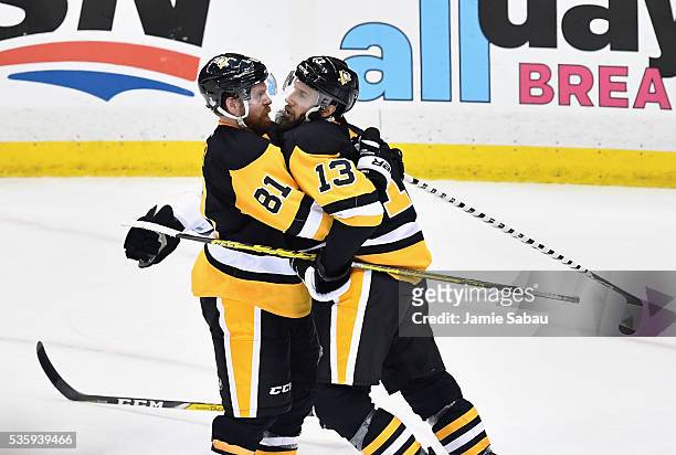 Nick Bonino of the Pittsburgh Penguins celebrates with Phil Kessel after scoring a third period goal against the San Jose Sharks in Game One of the...