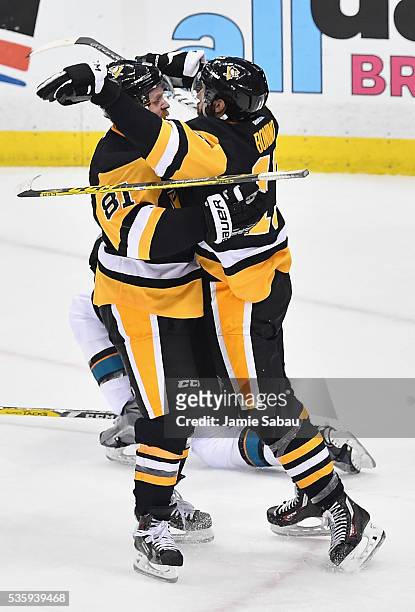 Nick Bonino of the Pittsburgh Penguins celebrates with Phil Kessel after scoring a third period goal against the San Jose Sharks in Game One of the...