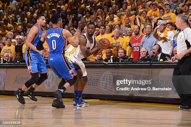 Harrison Barnes of the Golden State Warriors defends the ball against the Oklahoma City Thunder during Game Seven of the Western Conference Finals...