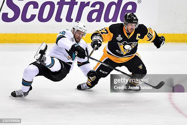 Nick Spaling of the San Jose Sharks skates against Sidney Crosby of the Pittsburgh Penguins during the first period in Game One of the 2016 NHL...