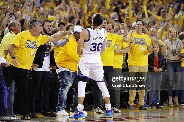 Stephen Curry of the Golden State Warriors celebrates after defeating the Oklahoma City Thunder 96-88 in Game Seven of the Western Conference Finals...