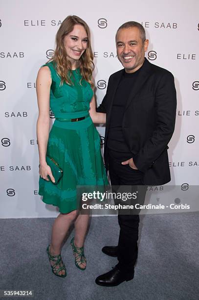 Elie Saab and Deborah Francois pose backstage after Elie Saab show as part of the Paris Fashion Week Womenswear Fall/Winter 2014-2015, in Paris.