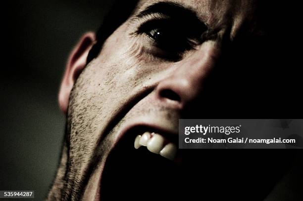 screaming man - scary face stock-fotos und bilder