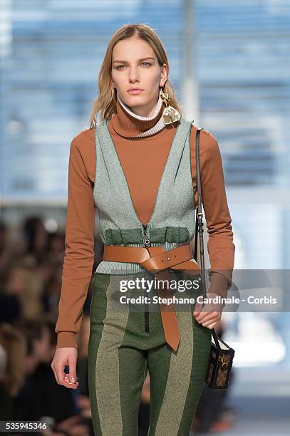 Model walks the runway during the Louis Vuitton show, as part of the Paris Fashion Week Womenswear Fall/Winter 2014-2015, in Paris.