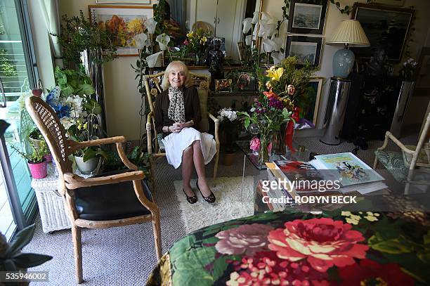 Retired film researcher Lillian Michelson poses in her room at the Motion Picture Television Fund Country House, a retirement community for members...