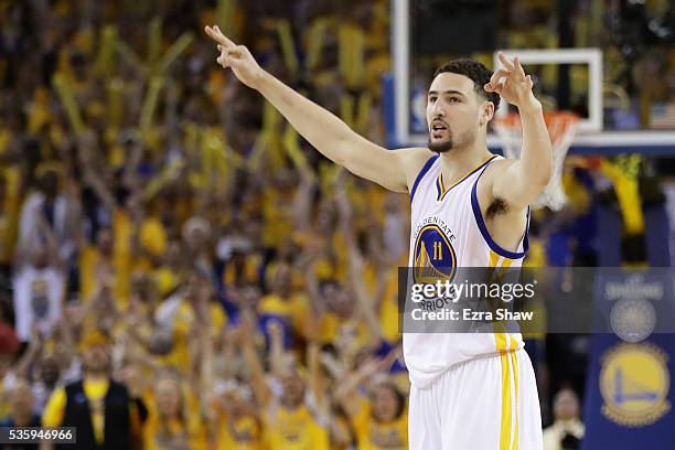 Klay Thompson of the Golden State Warriors reacts after hitting a three-point basket in Game Seven of the Western Conference Finals against the...