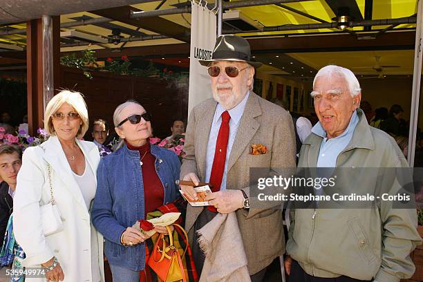 Charles Denner , Phillipe Noiret and his wife attend the Lacoste lunch during the Roland Garros French Open Tennis Tournament.