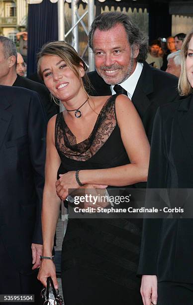 French actors Michel Leeb and Mathilde Seigner arrive at the premiere of director Claude Lelouch's movie "Le Genre humain - 1: Les Parisiens",...