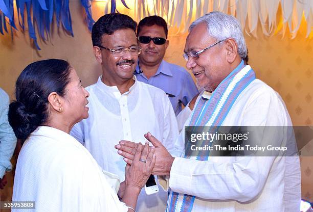 West Bengal Chief Minister Mamata Banerjee with Bihar Chief Minister Nitish Kumar after taking oath in Kolkata.