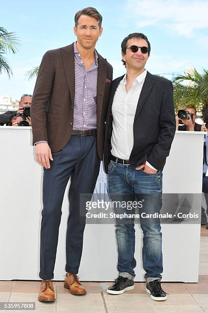 Ryan Reynolds and Atom Egoyan attend the "Captives" photocall during the 67th Cannes Film Festival.