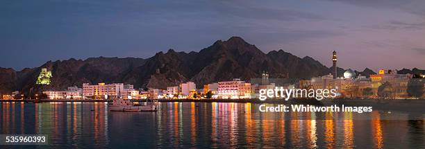 muscat harbour panorama at dusk, oman - matrah fort stock pictures, royalty-free photos & images