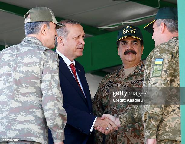 Turkish President Recep Tayyip Erdogan , talks with participants during the Efes-2016 Combined Joint Live Fire Exercise at Seferihisar district of...