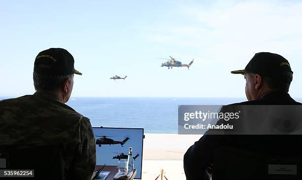 Turkish President Recep Tayyip Erdogan and Chief of the General Staff of the Turkish Armed Forces, Hulusi Akar attend the Efes-2016 Combined Joint...