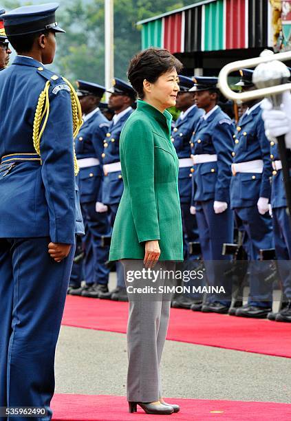 South Korean President Park Geun-hye looks at the Kenya Airforce marching May 31, 2016 at the State House in Nairobi, during the first state visit by...