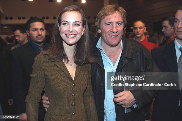 Carole Bouquet and G{rard Depardieu both attended the Chanel Fall-Winter 2001/2002 pret-a-porter show that was designed by Karl Lagerfeld.