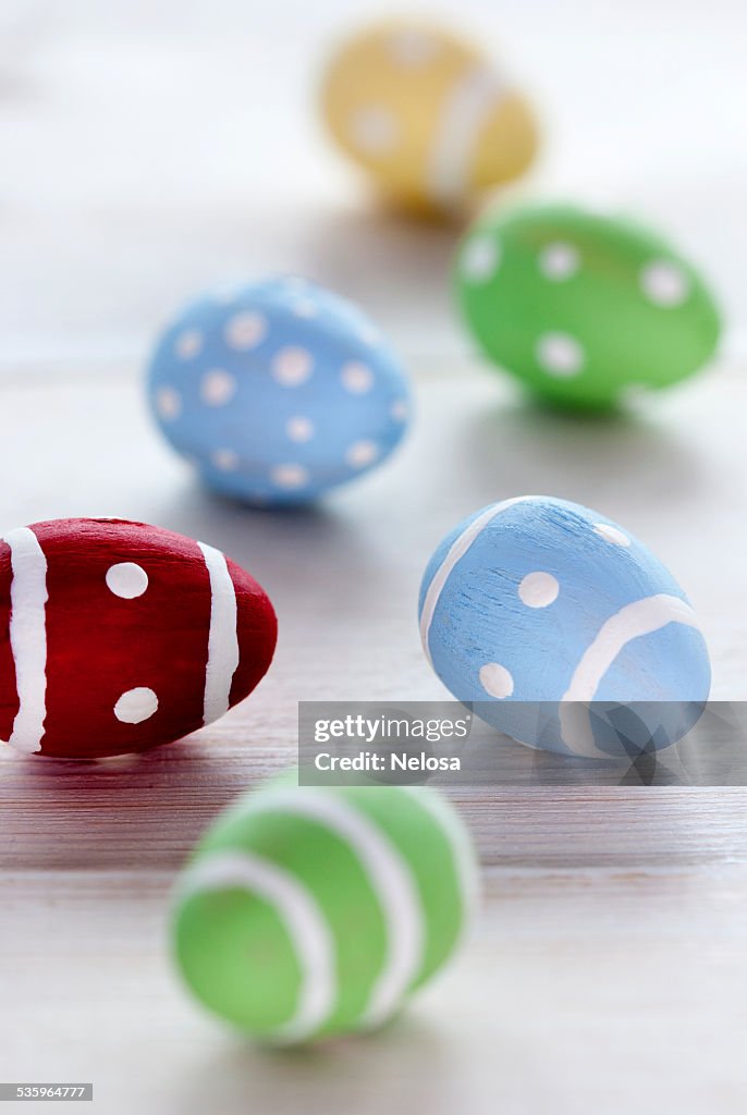 Close Up Of Many Colorful Easter Eggs On Wooden Background