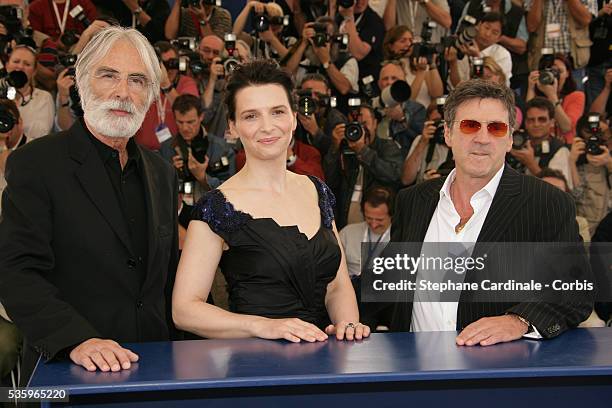 Director Michael Haneke, Juliette Binoche, Daniel Auteuil at the photocall of "Cache" during the 58th Cannes Film Festival.