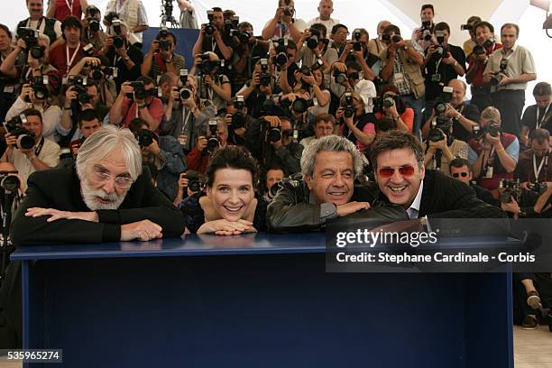 Director Michael Haneke, Juliette Binoche, Maurice Benichou and Daniel Auteuil at the photocall of "Cache" during the 58th Cannes Film Festival.