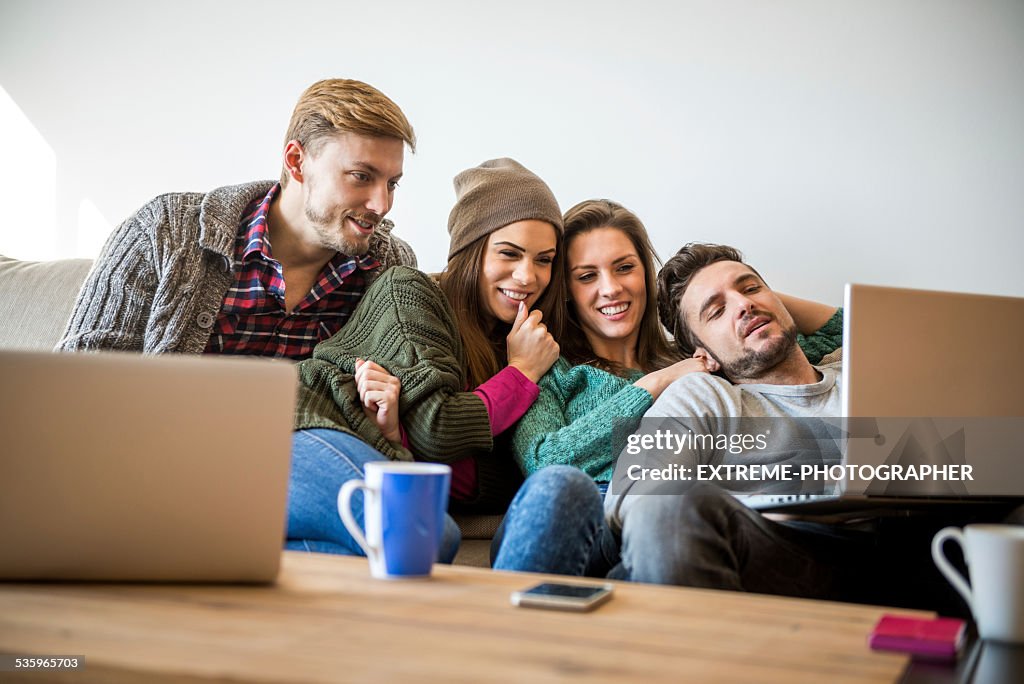 Four people watching multimedia content