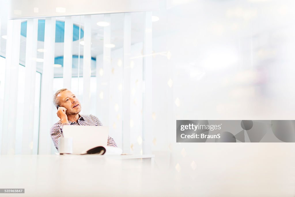 Businessman on the phone in office.