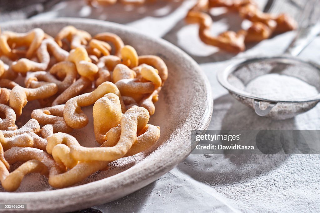 Sweet crisp pastry deep fried and sprinkled with powdered sugar.