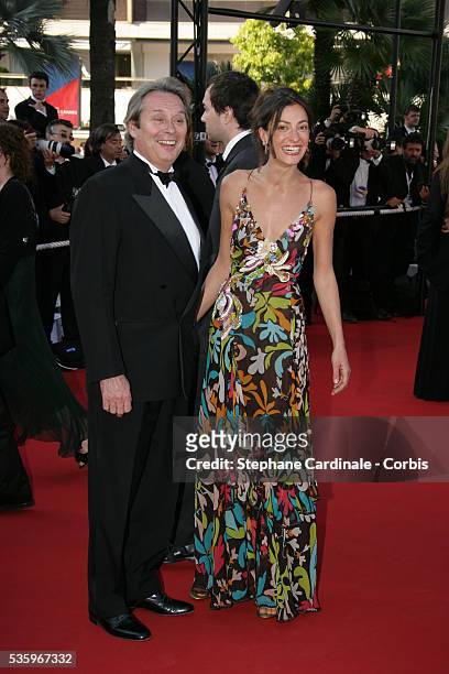 Actor Patrick Bouchitey and his wife attend the premiere of "Peindre ou Faire l'Amour" in competition at the 58th Cannes Film Festival.