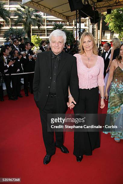 Actor Jacques Perrin and his wife attend the premiere of "Peindre ou Faire l'Amour" in competition at the 58th Cannes Film Festival.