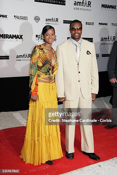 Actor Chris Tucker and his wife at the "AMFAR" party during the 58th Cannes Film Festival.