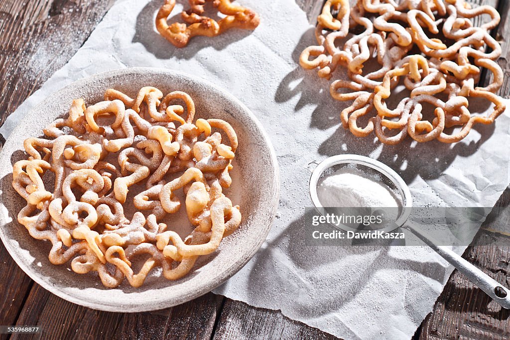 Sweet crisp pastry deep fried and sprinkled with powdered sugar