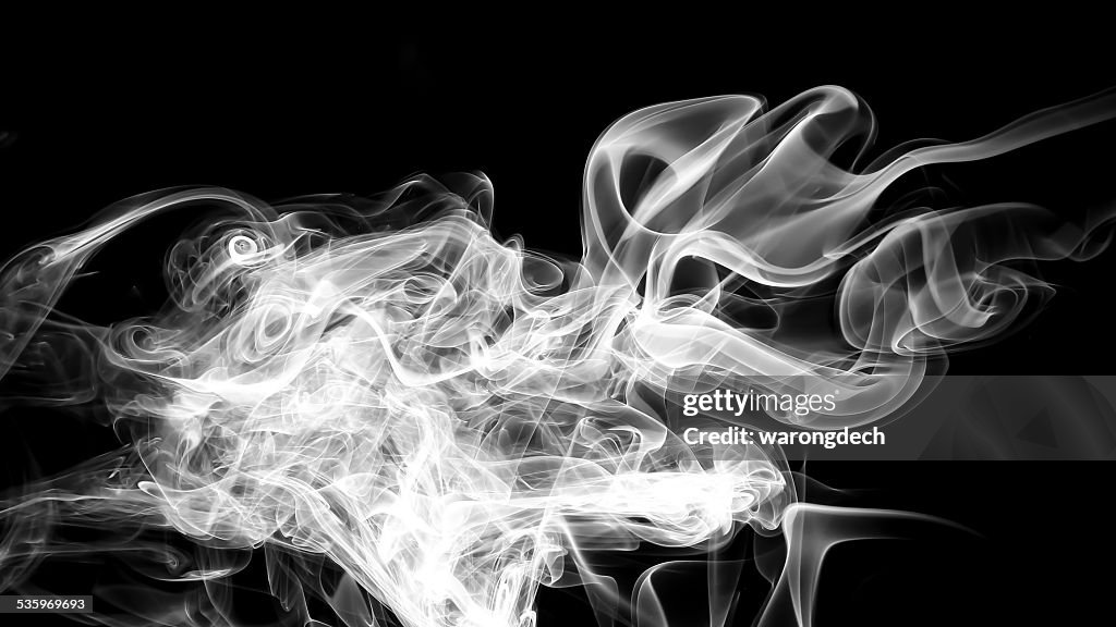 Abstract white smoke on black background.