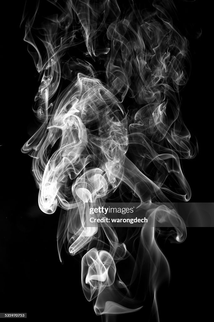 Abstract white smoke on black background.