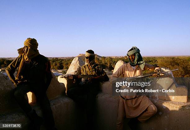 Young soldiers with the Forces Armees Nationales Chadiennes , or National Army of Chad, guard their post in Faya-Largeau with assault rifles and...