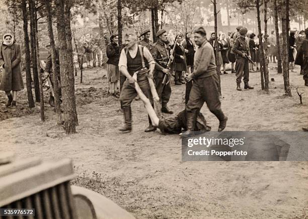 Scenes inside Belsen Concentration camp after it was liberated by British troops, 15th April 1945. The Royal Army Medical Corps, number 11 Light...