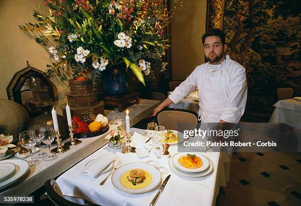 French chef Bernard Pacaud poses with several of his creations in his Paris restaurant L'Ambroisie. Pacaud has just been awarded a third Michelin...