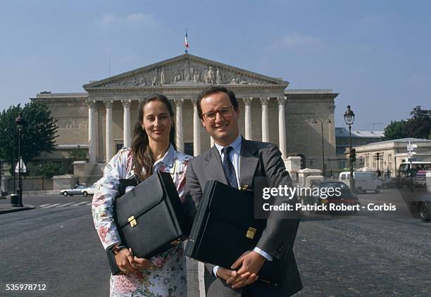 French socialist politicians Segolene Royal and husband Francois Hollande stand outside the National Assembly in Paris.