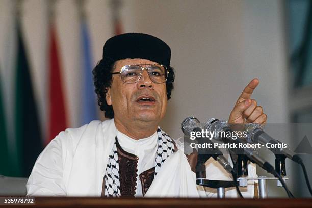 Colonel Muammar al-Qaddafi, Libyan head of state, speaks to the press at the close of the Algiers Summit, during which Arab leaders pledged major...