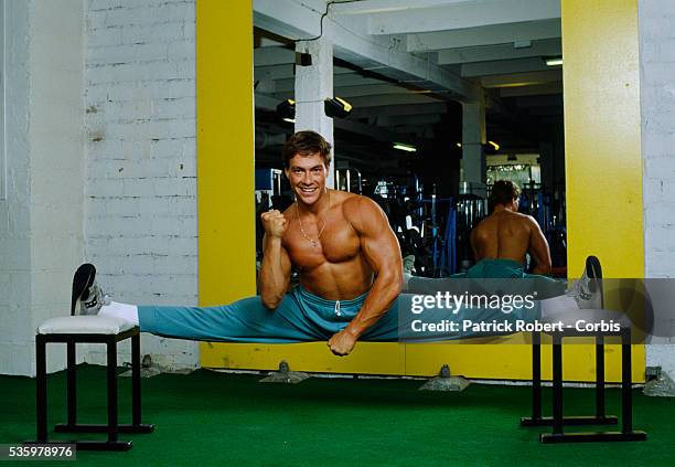 Martial arts actor Jean-Claude Van Damme working out at the Weider Gym in Paris in 1988.