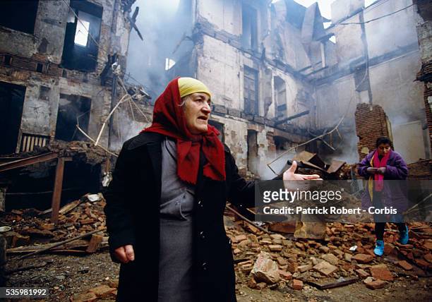 Woman looks over the rubble of her destroyed home in Tbilisi during civil war in the former Soviet republic of Georgia. Fighting broke out in Tbilisi...