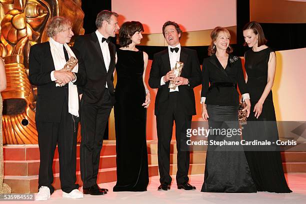 French actor Pierre Richard and winner of an Honorary Cesar, on stage with actor Lambert Wilson, host Valerie Lemercier, British actor Hugh Grant and...