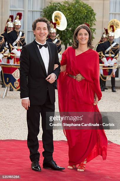 Guillaume Gallienne and Amandine Gallienne arrive at the Elysee Palace for a State dinner in honor of Queen Elizabeth II, hosted by French President...