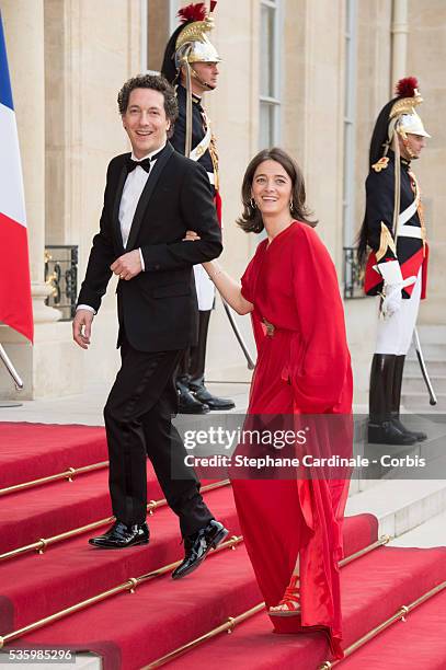 Guillaume Gallienne and Amandine Gallienne arrive at the Elysee Palace for a State dinner in honor of Queen Elizabeth II, hosted by French President...