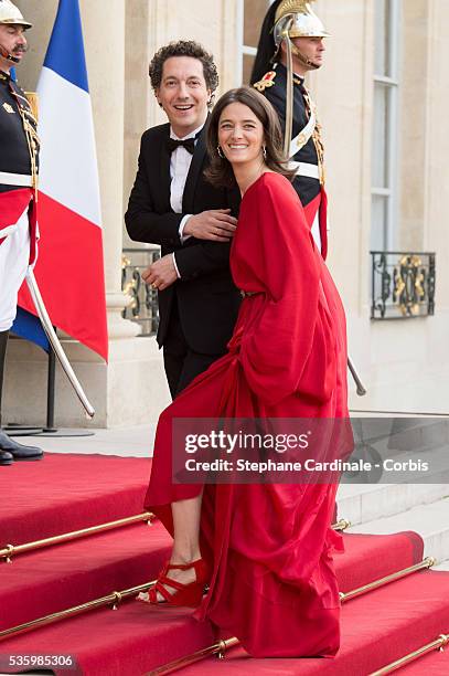 Guillaume Gallienne and Amandine Gallienne arrive at the Elysee Palace for a State dinner in honor of Queen Elizabeth II, hosted by French President...