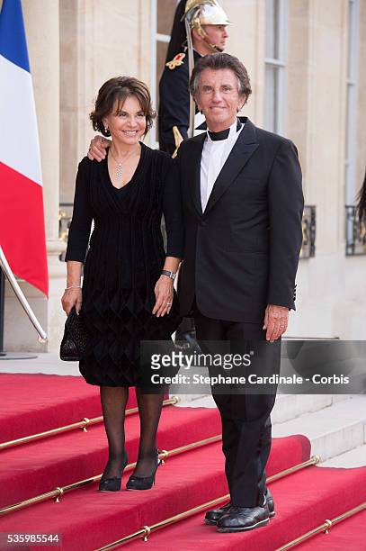 Bernard Kouchner and his wife arrive at the Elysee Palace for a State dinner in honor of Queen Elizabeth II, hosted by French President Francois...