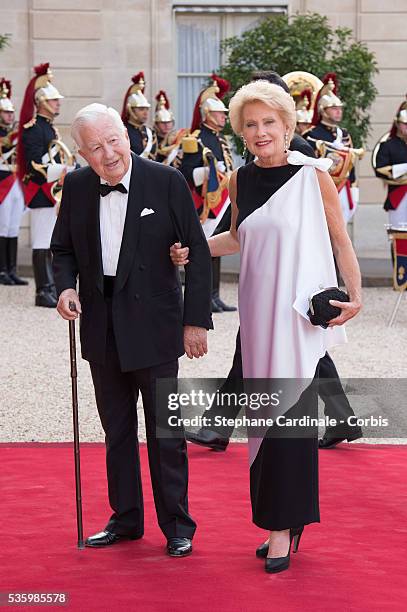 Jean Bernard Raimond and Monique Raimond arrive at the Elysee Palace for a State dinner in honor of Queen Elizabeth II, hosted by French President...