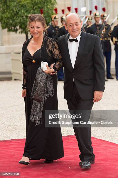 French Minister of defence Jean-Yves Le Drian and his wife arrive at the Elysee Palace for a State dinner in honor of Queen Elizabeth II, hosted by...