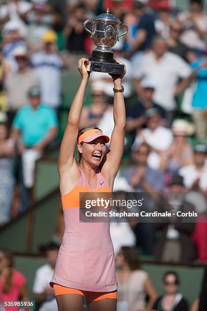 Maria Sharapova of Russia poses with the Coupe Suzanne Lenglen trophy following her victory in the women's singles final match against Simona Halep...