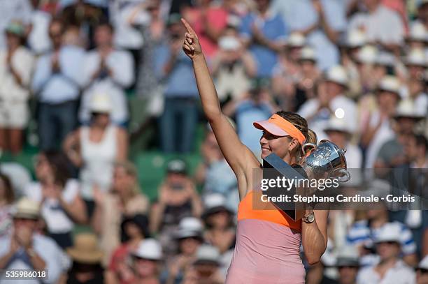 Maria Sharapova of Russia poses with the Coupe Suzanne Lenglen trophy following her victory in the women's singles final match against Simona Halep...