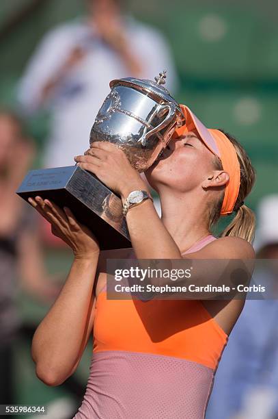 Maria Sharapova of Russia poses with the Coupe Suzanne Lenglen trophy following her victory in the women's singles final match against Simona Halep...