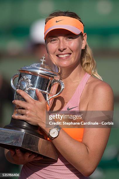 Maria Sharapova of Russia poses with the Coupe Suzanne Lenglen trophy following her victory in the women's singles final match against Simona Halep...