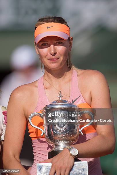 Maria Sharapova of Russia poses with the Coupe Suzanne Lenglen trophy following her victory in the women's singles final match against Simona Halep...